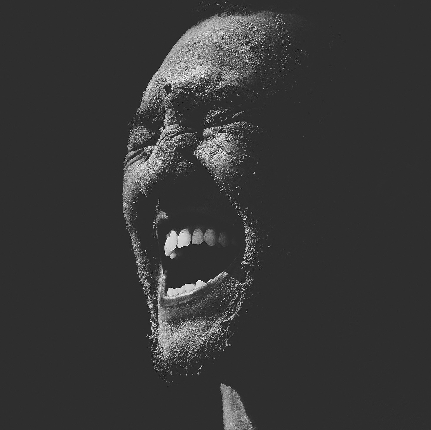 portrait of a man black and white close-up laughter liberation